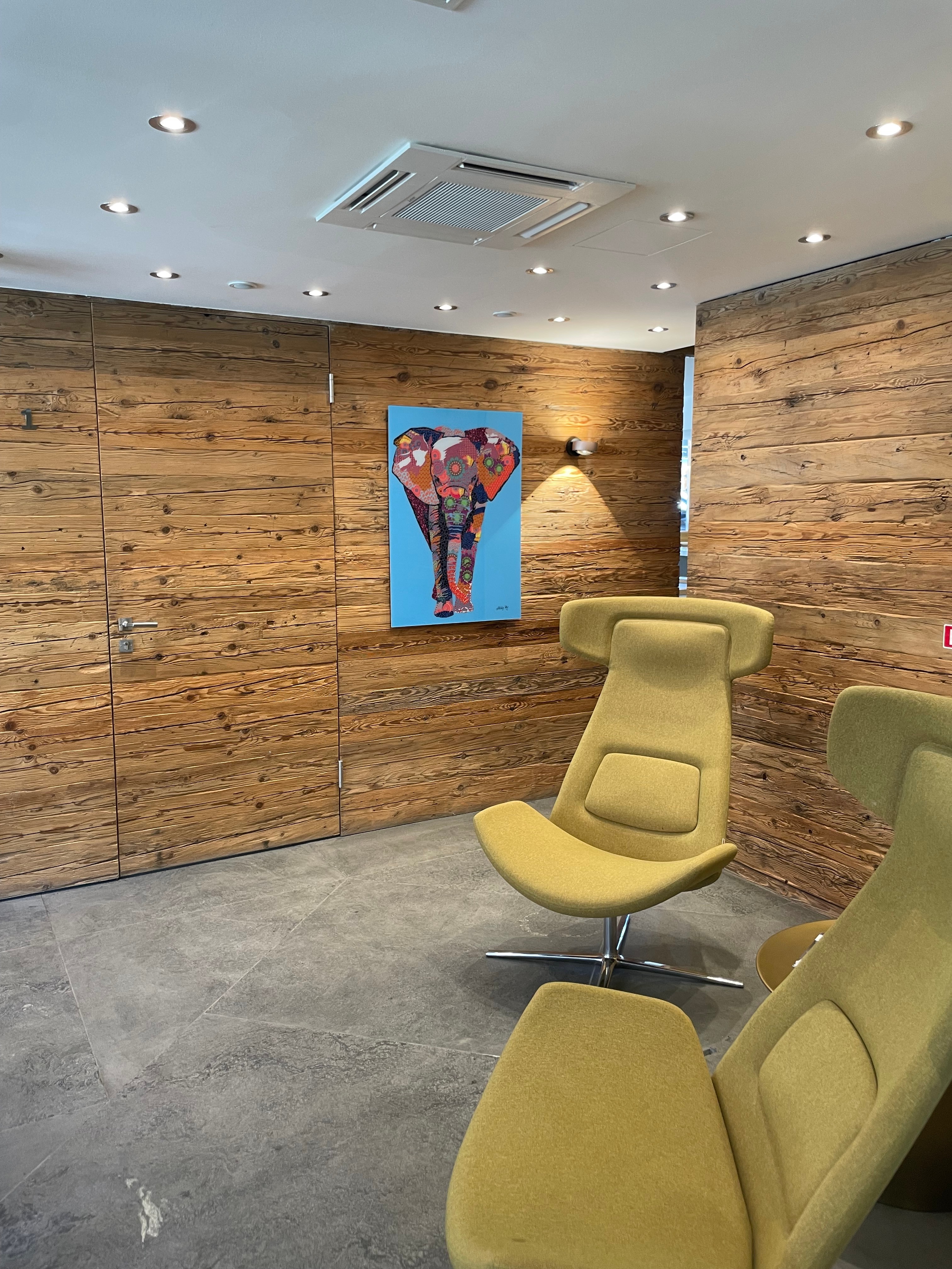 The warm, wood-panelled waiting room at The Verbier Touch clinic